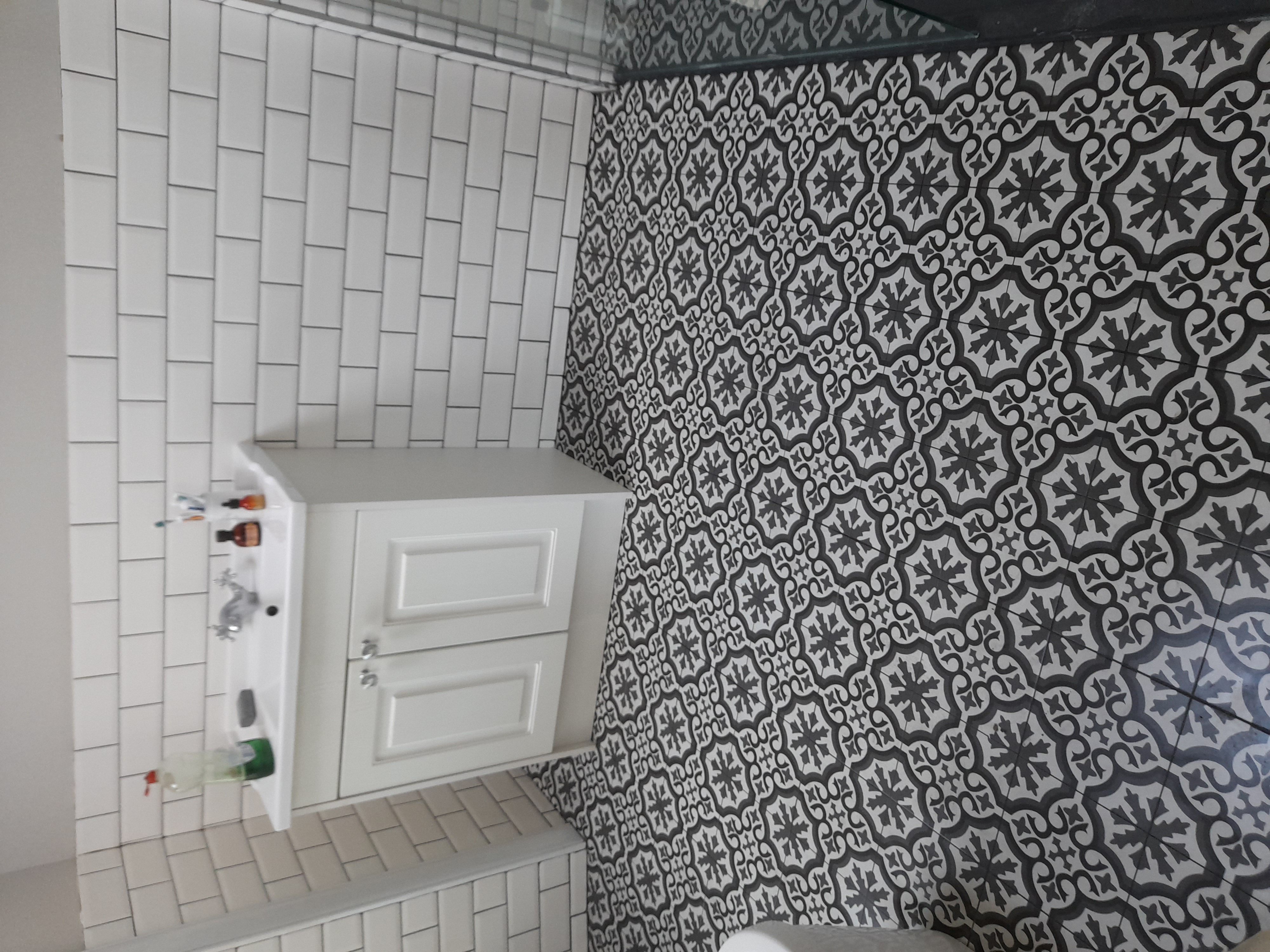 Patterned floor with metro wall tiles
